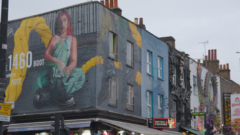 Painted-And-Sculpted-Advertising-Displays-On-Outside-Of-Store-Buildings-In-Camden-North-London-UK